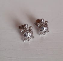 Marked 925 sterling silver stud earrings in the shape of a turtle frog with small polished white cubic zirconia stones