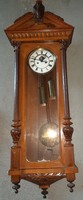 Two heavy pewter wall clocks with crested faces