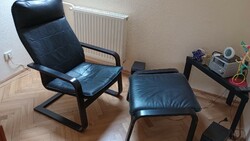 Black armchair with footrest