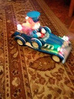 Antique jallopy toy car with battery-powered vinyl that works beautifully and makes a sound, according to the pictures
