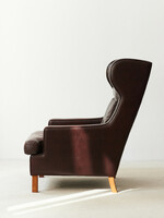 Danish midcentury armchair with leather and rosewood handles