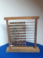 Old wooden abacus (the lack of balls is replaced with old-fashioned porcelain snails)