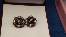Antique gold-plated silver earrings decorated with pearls with garnets