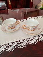 From a set of 2 German porcelain gilded flower coffee sets: cup + saucer