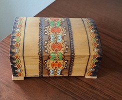 Wooden chest with burnt and painted motifs
