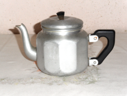 Retro old metal tea jug with spout