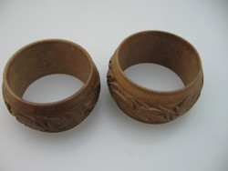 A pair of wooden carved napkin rings