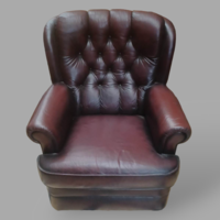 Genuine leather armchair with stitched backrest