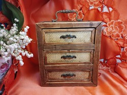 Wooden chest of drawers with copper handles