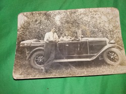 Antique sepia postcard of the proud owner and his family with perhaps a rover (?) car according to the pictures