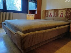 Double bed with linen holder