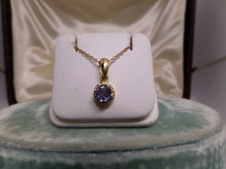 Gold pendant with blue tanzanite and brils