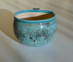 Curved ceramic tea mug with plant print