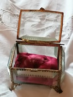 Old, polished glass reliquary box for sacred relics.