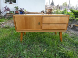 High-gloss sideboard (small chest of drawers) made of beech wood with ultra-cool drawers from the sixties.