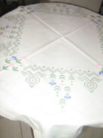 Floral tablecloth embroidered with beautiful colored crosses