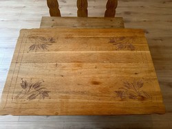 Solid wood dining table with benches, carved flower motifs