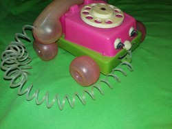 Old Hungarian small-scale traffic goods rattling pullable plastic toy telephone as shown in the pictures