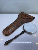Leather case with magnifying glass