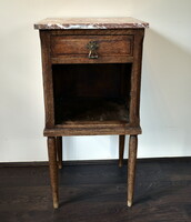 XX. The first half of the room is a marble flat bedside cabinet