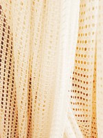A pair of white thread curtains