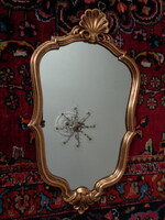 Beautifully shaped gilded - carved mirror
