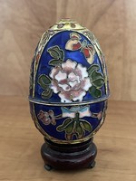 Fairy large fire enamel openable egg with three-legged wooden holder.