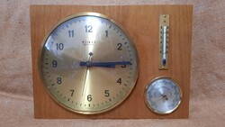 Old clock with thermometer and barometer