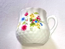 Vintage Zsolnay mug with spring flower bouquet