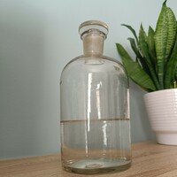 Antique apothecary bottle with wide neck and matching polished glass stopper