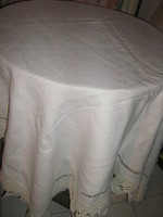 Beautiful antique off-white elegant woven tablecloth with crocheted edges