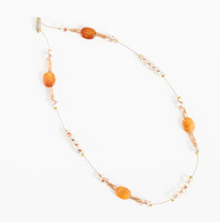 Modern jewelry made of glass beads - yellowish and opal white elements