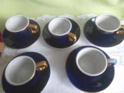 Retro coffee cups with gilded edges and saucers