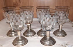 Set of old polished glass glasses with metal bases