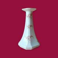 Porcelain candle holder decorated with flower motifs
