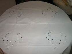 Beautiful pale blue madeira tablecloth with floral embroidery and lace edges