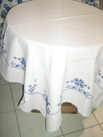 Beautiful blue floral tablecloth embroidered with cross stitches