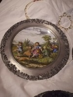 Seasonal porcelain plates in tin frames
