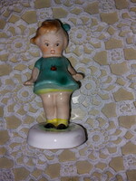 Bodrogkeresztúr porcelain figurine/nipp with a ladybug in a dark green dress