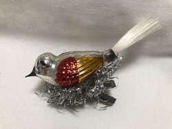 Antique, old Christmas tree decoration, glass bird with tweezers in the nest