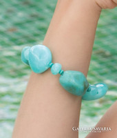 Bracelet made of quality turquoise colored acrylic beads with small wooden beads