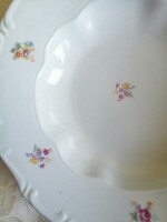 Baroque antique plate with scattered flowers