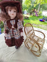 Vintage porcelain head doll with rocking chair