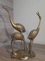 Copper statue of heron birds