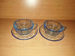 A pair of blue glass cups with bottoms