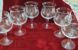 A set of beautifully shaped incised stemmed glasses