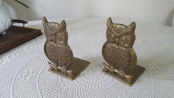 A pair of brass owl-shaped bookends