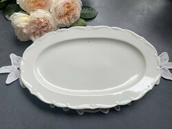 A fine white serving plate with a small zigzag edge for cakes and pies