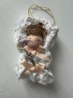 Christmas tree decoration for baby in swaddling clothes from old and new materials