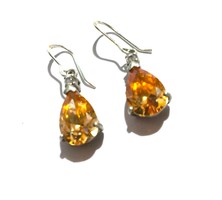 Silver earrings with sparkling peach colored drop gemstones
